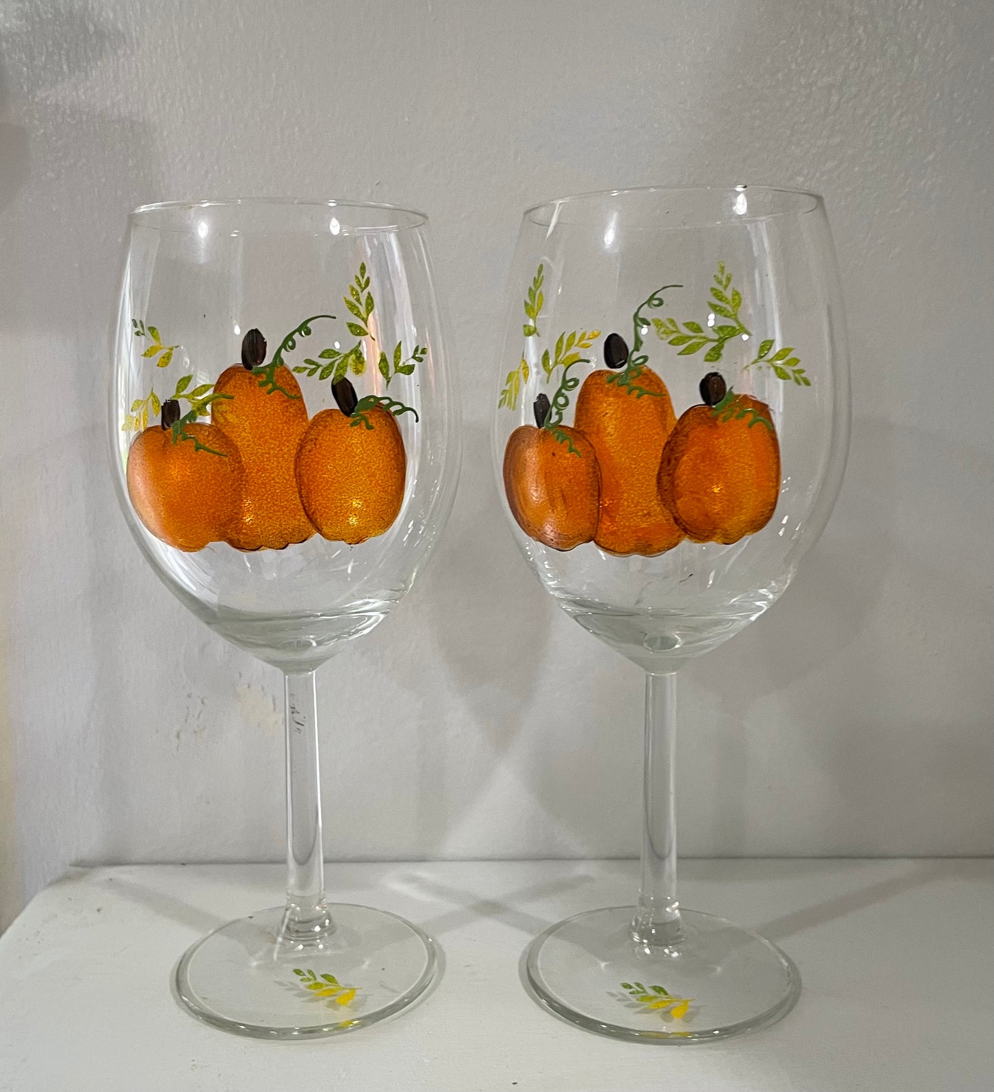 Three Pumpkin Hand Painted on a 15 oz stemmed wine
