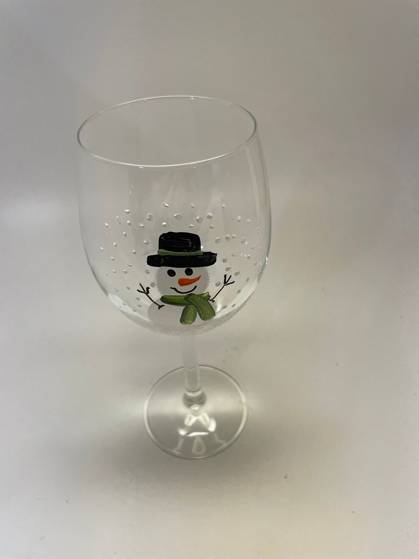 Hand Painted Snowman Wine glass with green scarf and hat