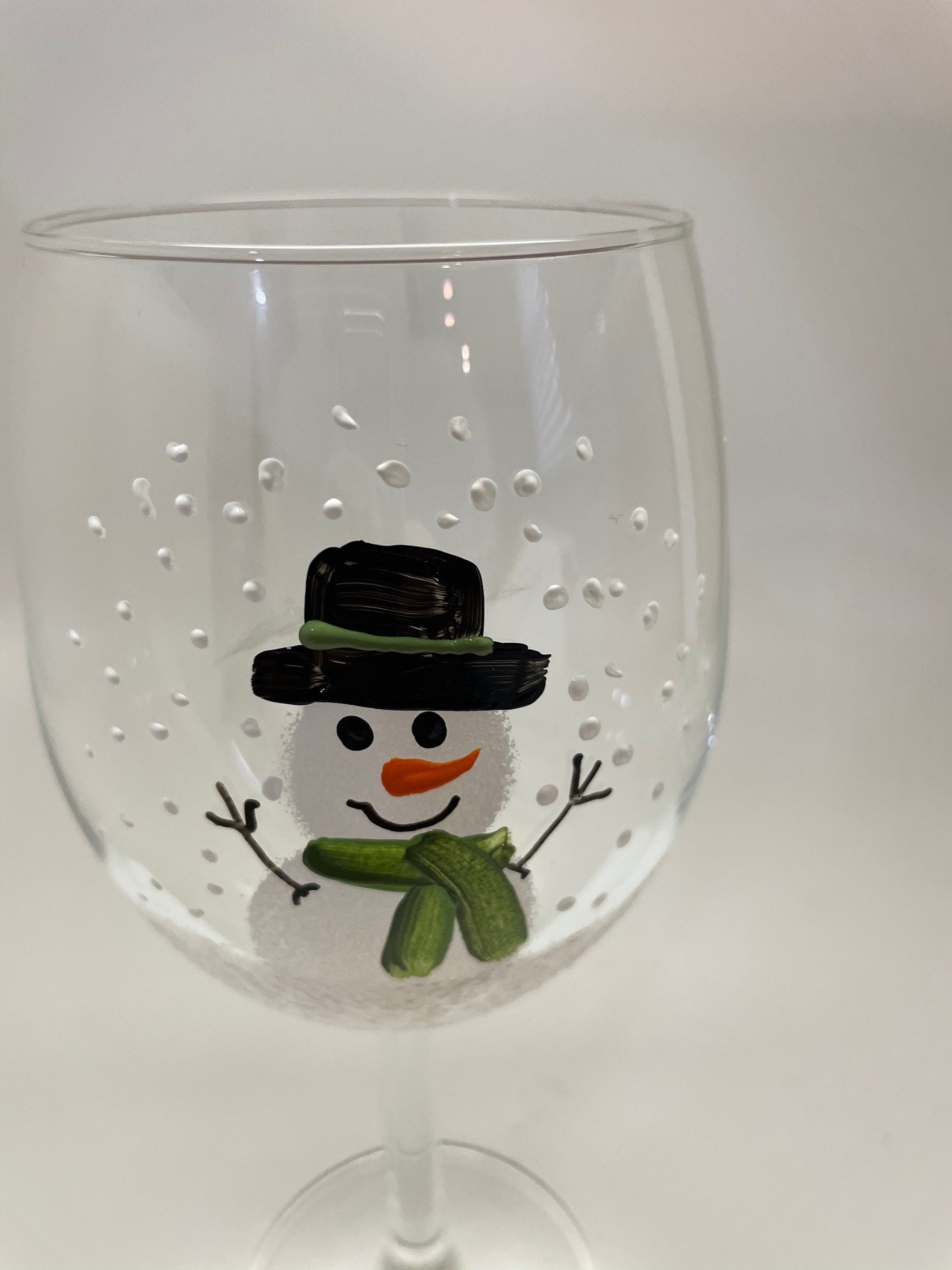 Hand Painted Snowman Wine glass with green scarf and hat