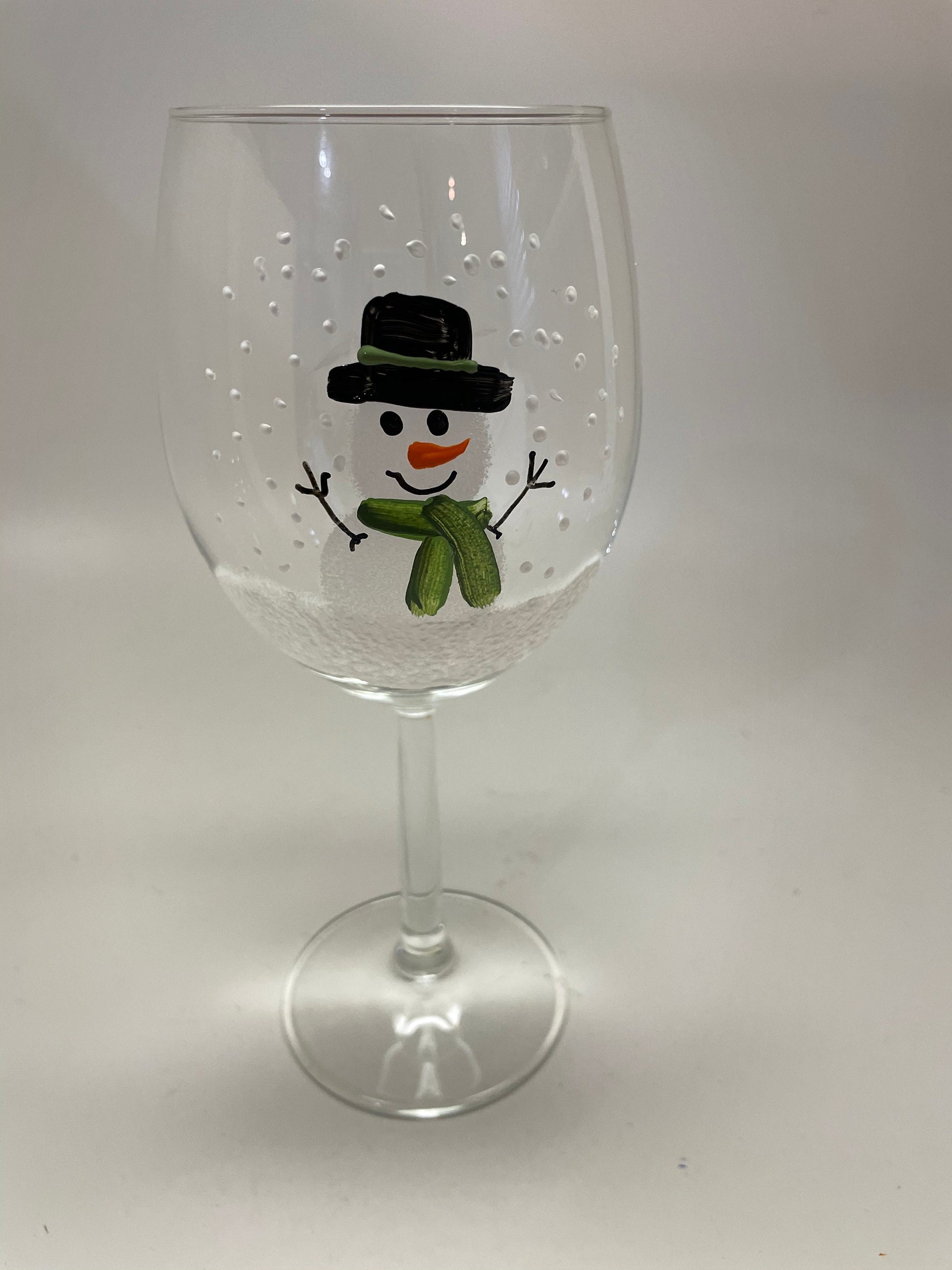 Hand Painted Snowman Wine glass with green scarf and hat