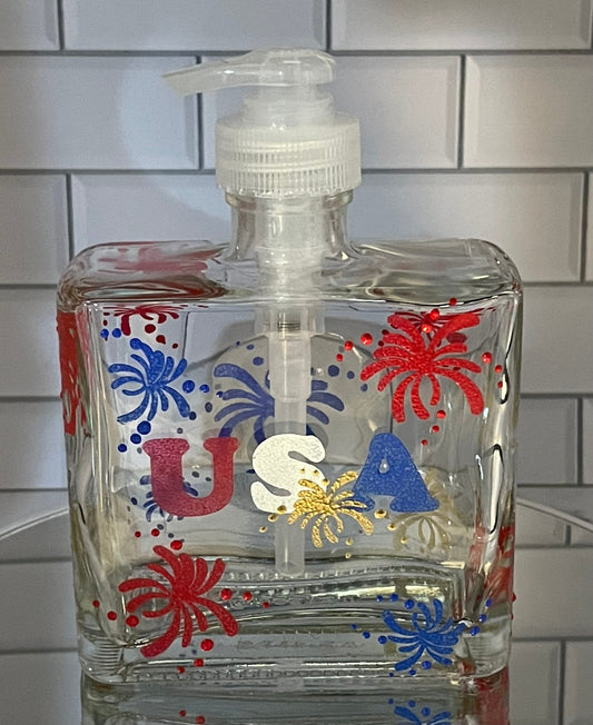 Patriotic USA soap dispenser for 4th of July with red, blue and gold fireworks and USA on the front.