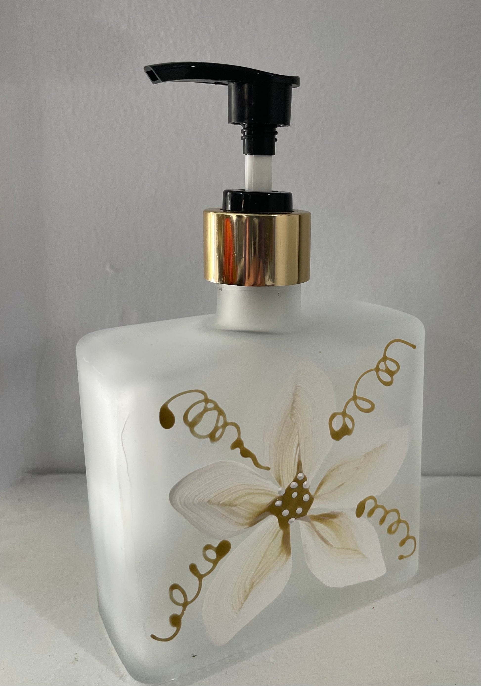 Hand painted Soap or Lotion Dispenser with white and gold flower on both sides of bottle